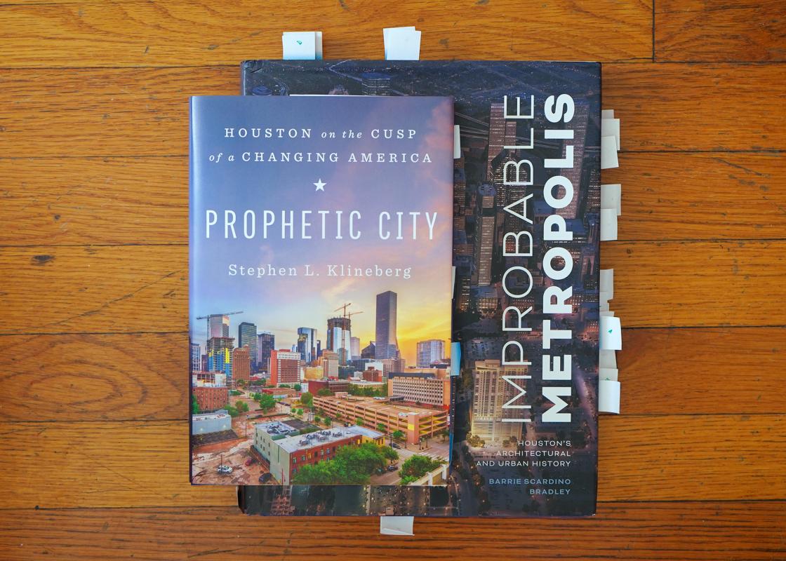An editor's copies of "Prophetic City" and "Improbable Metropolis."