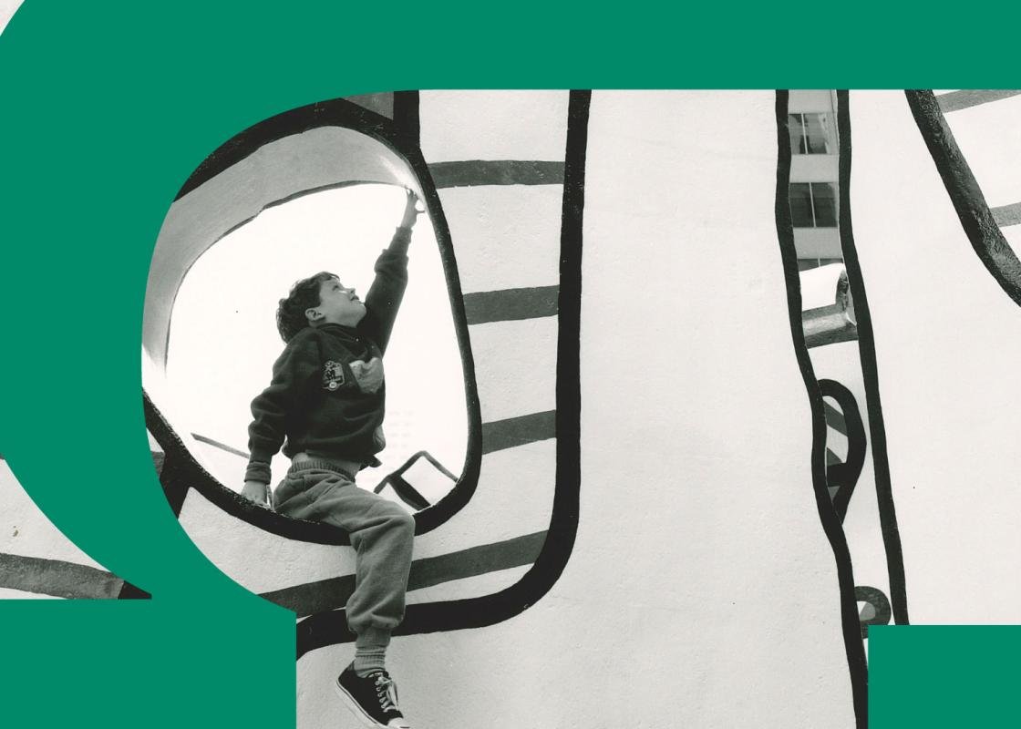 Black and white photograph of child in a sculpture