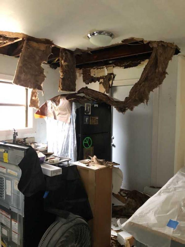 A ceiling completely caved in from a burst pipe. Courtesy West Street Recovery.